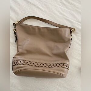 Taupe, soft pebble leather shoulder bag with interior compartments and detail.